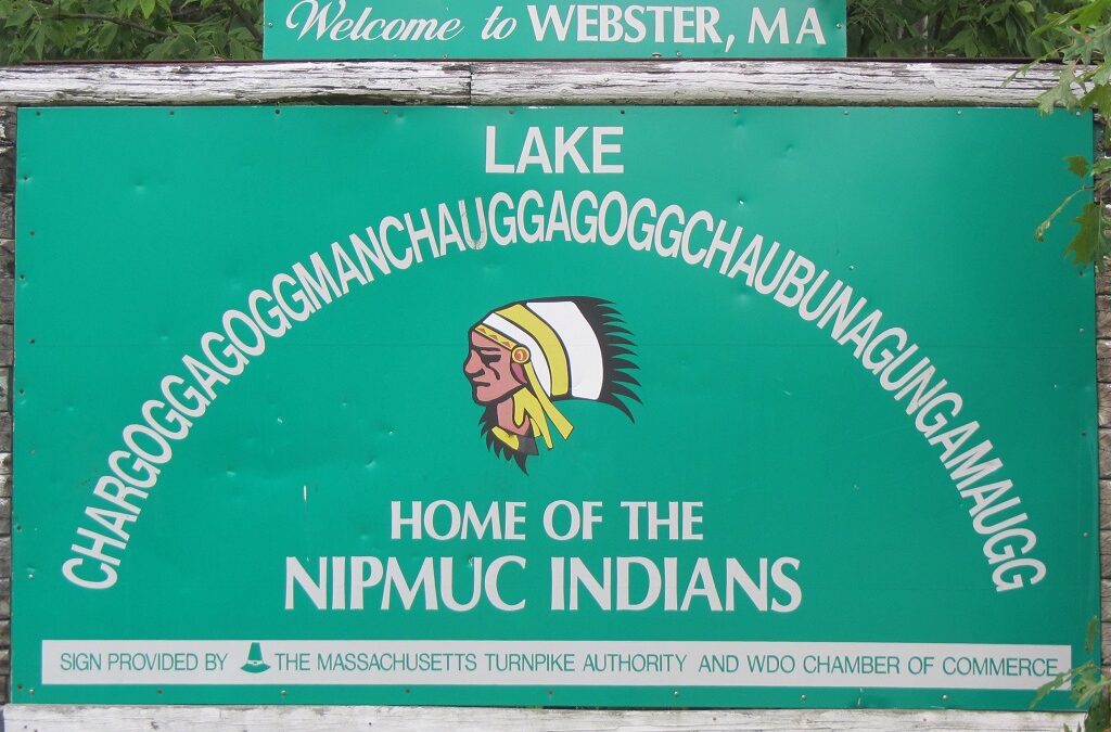 Signboard welcoming visitors to Webster, MA, featuring Lake Chargoggagoggmanchauggagoggchaubunagungamaugg and home of the Nipmuc Indians.